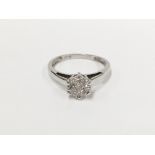 A quarter carat 7 stone diamond 18 carat white gold ring,