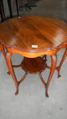 A 19th century 6 legged occasional table with lower tier