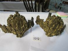 A pair of Victorian brass brackets depicting Swedish opera singer Jenny Lind