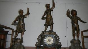 A 3 piece clock garniture being clock surmounted figure and 2 side figures