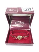 A 9ct gold Rotary wrist watch with gold fancy bracelet and safety chain