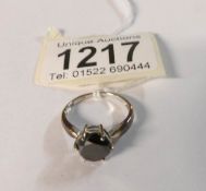 A 9ct gold tine set black stone, HM Birmingham 2006,