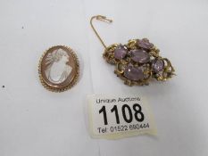 A gold cameo brooch and a yellow metal brooch set amethyst coloured stones (some repairs)