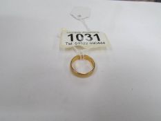 A 22ct gold wedding band, size K,