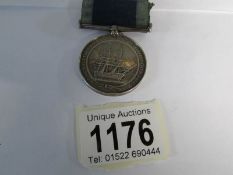 A Victorian Long Service medal awarded to W H McColley, Leading Stoker,