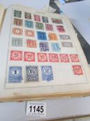 2 albums of stamps, GB/empire and world together with a folder of South America,