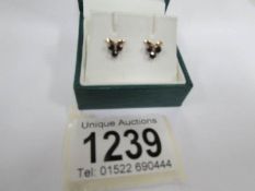A pair of sapphire ear studs in gold
