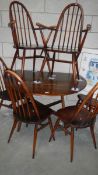 An Ercol dining table and 6 Ercol chairs