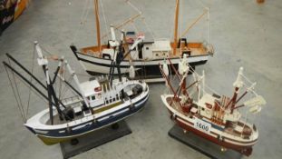 3 wooden model boats