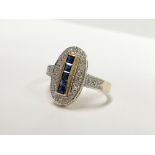 An oval yellow gold sapphire and diamond ring,