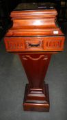 A mahogany pedestal