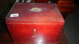 A wood box containing old photographs