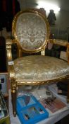 A gilded salon chair