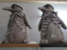 A pair of penguin figures