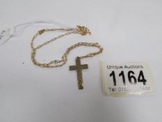 A 9ct gold cross on 9ct gold chain (2 grams)