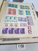 A 51 page album of stamp multiples (mint and used) GB/Empire and world