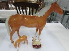 A large Beswick horse with foal and dog