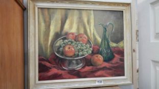 An oil on board still life of bowl of fruit with jug,