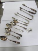 3 silver sugar tongs and 6 silver teaspoons,