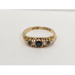 An 18ct gold diamond and sapphire ring,