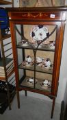 An Edwardian inlaid display cabinet