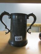 A large pewter cup for 1875 Trinity Hall Trial Eights winning crew