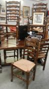 An oak dining table with 2 carvers and 4 dining chairs
