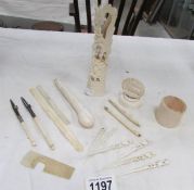 A quantity of ivory and bone items including parasol handle