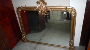 A gilt framed overmantel mirror,