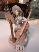 A Lladro girl playing cello - Concerto,