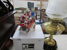 A boxed Disney Parks Santa MK figurine sleigh