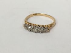 An 18ct gold ring set diamonds, stamped 18ct,