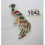 A lovely jewelled peacock brooch