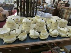 A large quantity of Jasmine Wood's Ware yellow tea and dinner ware