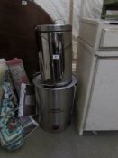 A Burco boiler and a stainless steel pedal bin