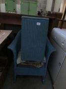 A LLoyd Loom chair and linen bin