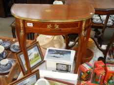 An inlaid D shaped hall table