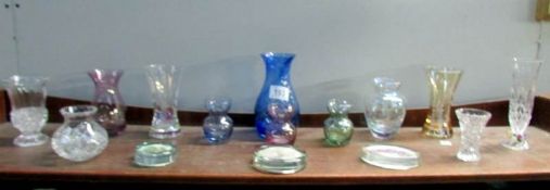 A shelf of assorted glass ware