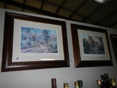A pair of framed and glazed rural scene prints