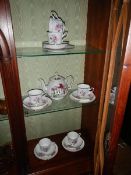 A quantity of rose decorated tea ware