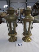 A pair of small brass lanterns