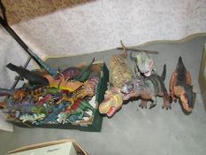 A large quantity of toy dinosaurs