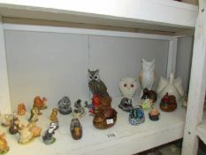 A shelf of assorted animal figures