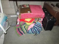 A quantity of crocheted blankets and a candlewick bedspread
