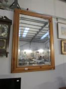 A pine framed bevel edge mirror