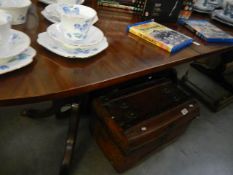 A mahogany extending dining table
