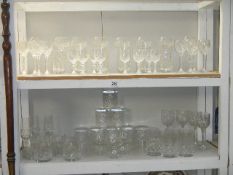 2 shelves of assorted cut glass including whiskey tumblers, brandy glasses etc.