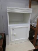 A white bedside cabinet