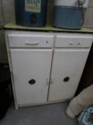 A vintage kitchen cabinet