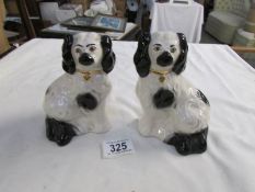 A pair of small Staffordshire spaniels